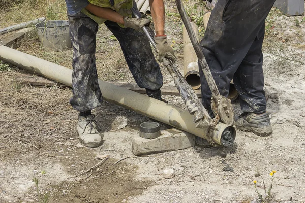 Drilling rig werknemers teamwerk — Stockfoto