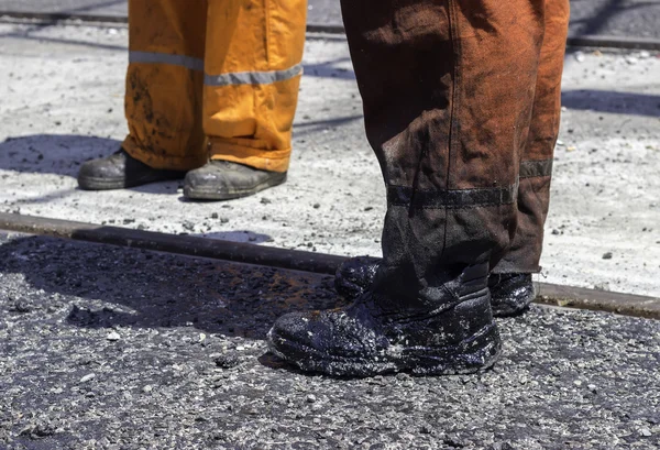 Worker legs with dirty boots — Stock Photo, Image