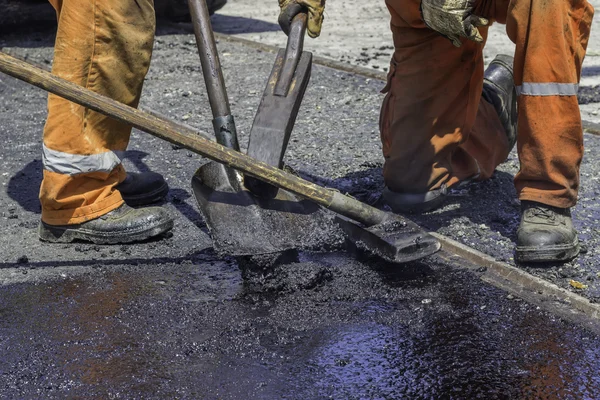 Workers teamwork during road renewal works — Stock Photo, Image