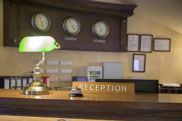 Hotel front desk with focus on reception sign 2 — Stock Photo, Image