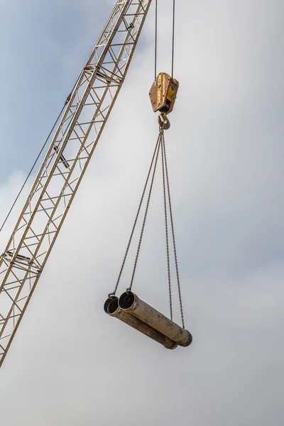 Crane hook with two pipes — Stock Photo, Image