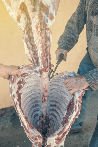 Butcher slicing raw pork 2 — Stock Photo, Image