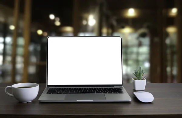 Front view of open laptop computer notebook with blank monitor white screen display on work table desk. Workspace office modern for job business online communication technology in shop or home indoor.