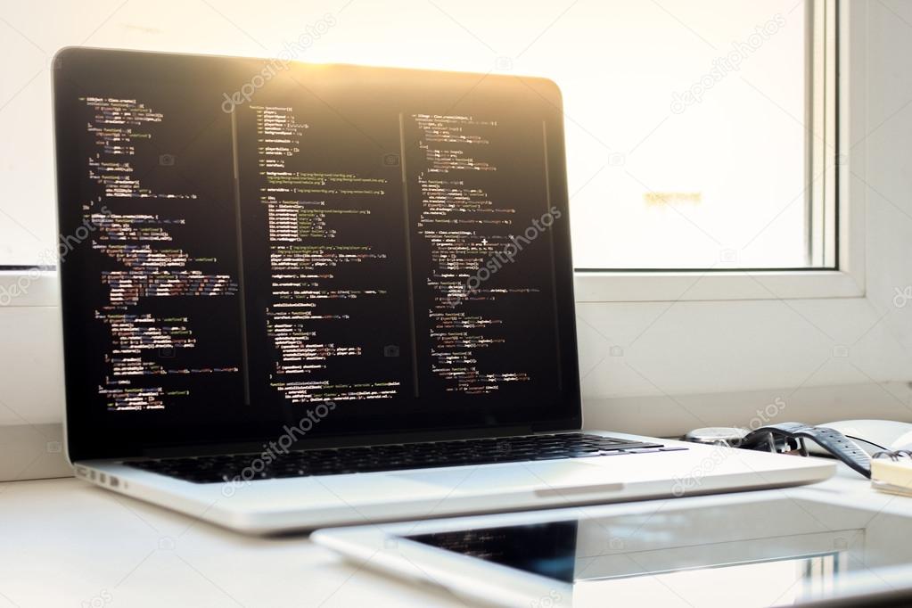 js code on laptop screen, web development