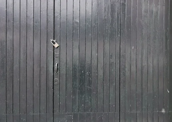 Fondo de puerta de madera negro pintado — Foto de Stock