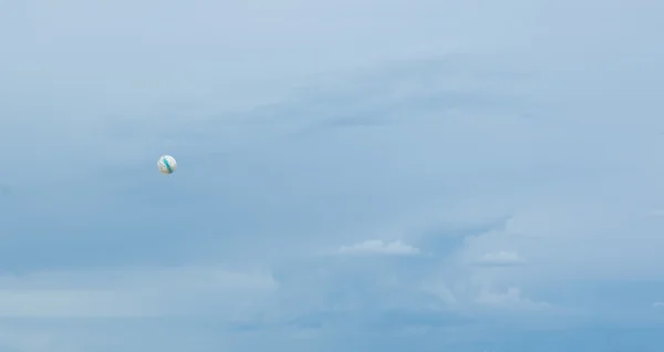 Soccer ball high up in the air — Stock Photo, Image