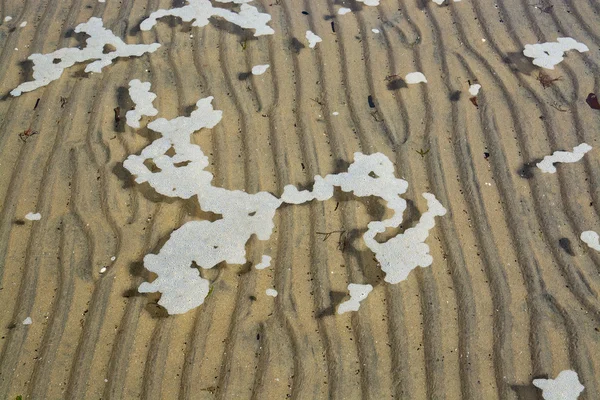 Абстрактный песок и морская пена — стоковое фото