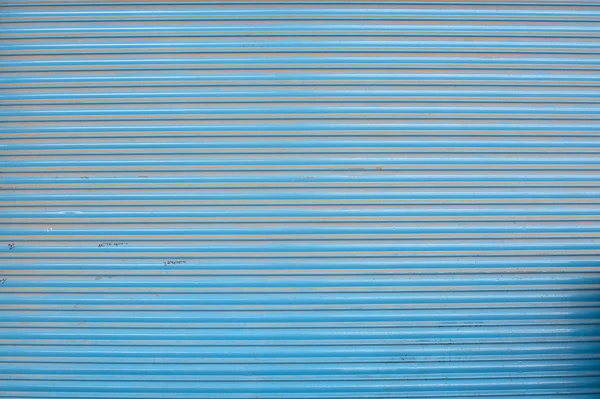 Azul ondulado pintado metal fundo textura — Fotografia de Stock