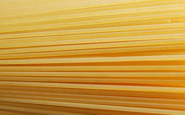 Paralel uzanan spagettinin arka planı. Spagetti arka planı oluşturur..