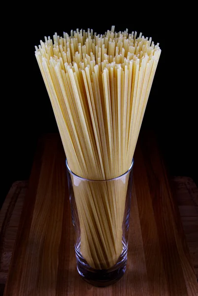 Glass Spaghetti Stands Wooden Board — Stock Photo, Image