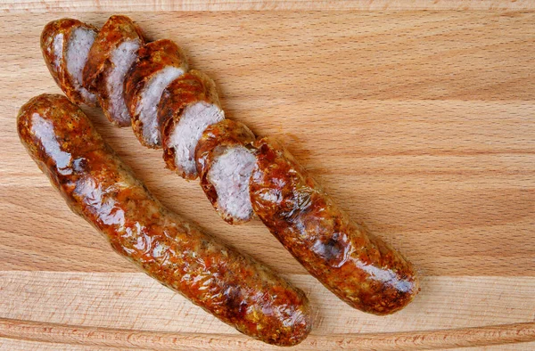 Two Fried Sausages Wooden Cutting Board — Stock Photo, Image