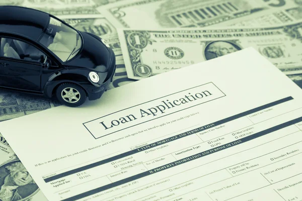 Formulario de solicitud de préstamo con coche y dinero, Sepia tonificado —  Fotos de Stock