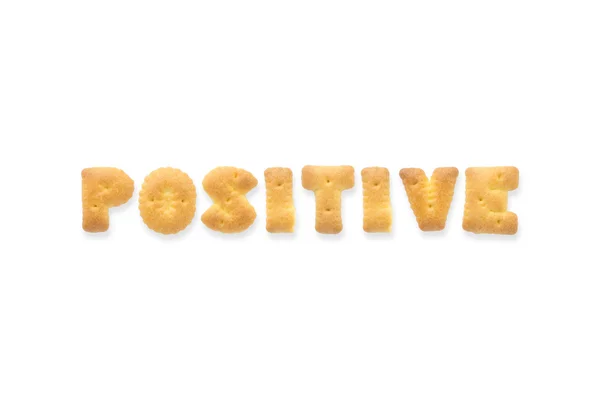 ตัวอักษรคํา POSITIVE ตัวอักษรบิสกิตแครกเกอร์ — ภาพถ่ายสต็อก