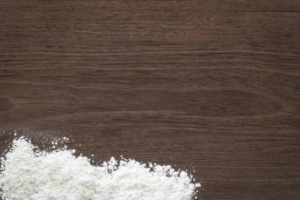 Baking background, flour on vintage wood table — Stock Photo, Image