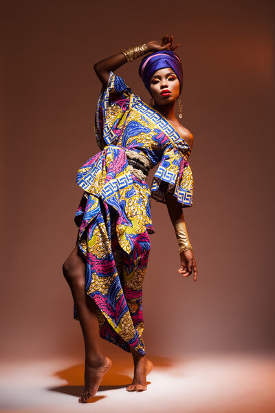 Dance hot African night, a beautiful woman in a bright dress
