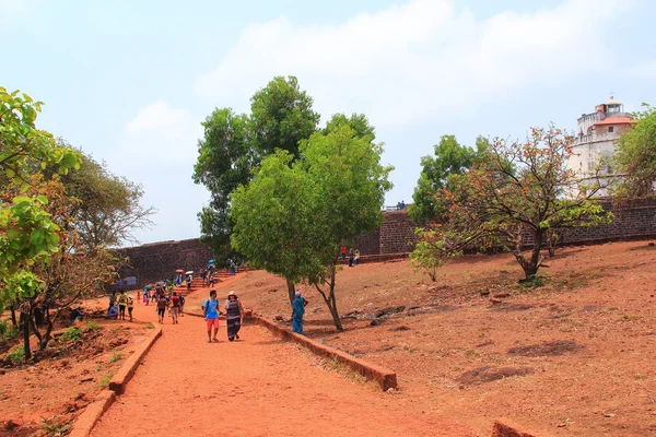 CANDOLIM, GOA, INDIA - 11 APR 2015: Ancient Fort Aguada and lighthouse  built in the 17th century. — Stock Photo, Image