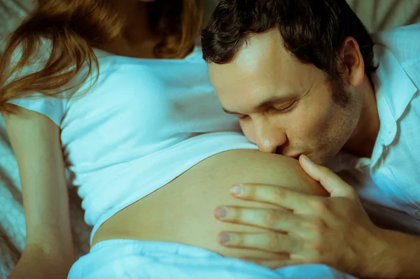 Image of happy future dad kiss the belly of his pregnant wife — Stock Photo, Image