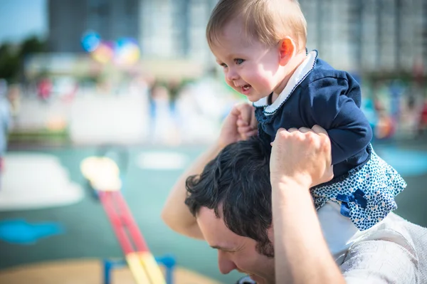 Image of cute little daughter in young dads hands — Stock Photo, Image