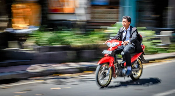 Man riding a scooter — Stock Photo, Image