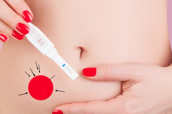 Pregnancy test with egg and sperm illustration — Stock Photo, Image