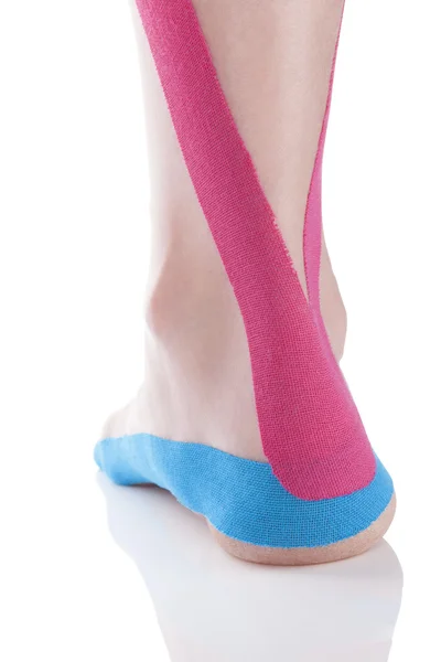 Kinesio tape on female heel. — Stock Photo, Image