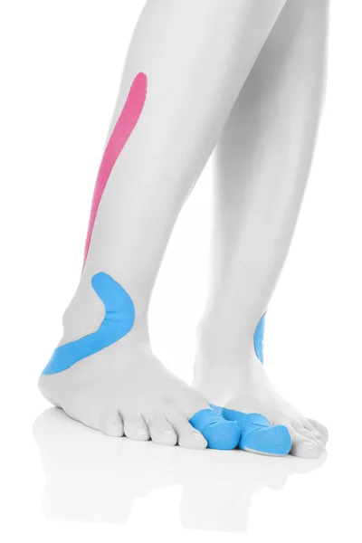 Therapeutic tape on female feet. — Stock Photo, Image
