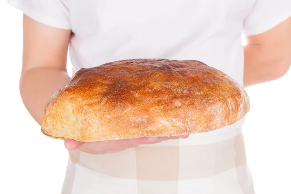 Baker holding fresh made bread. — Stock Photo, Image