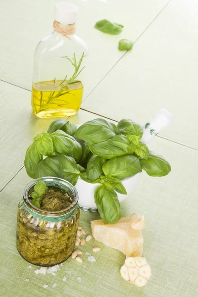 Basil pesto with ingredients. — Stock Photo, Image