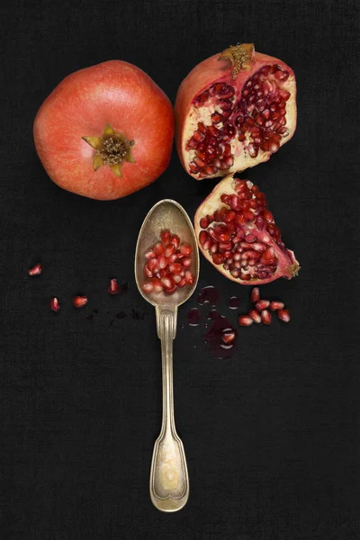 Pomegranate core on black background — Free Stock Photo