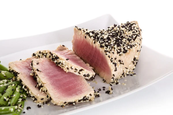 Tuna slices with white and black sesame seeds. — Stock Photo, Image