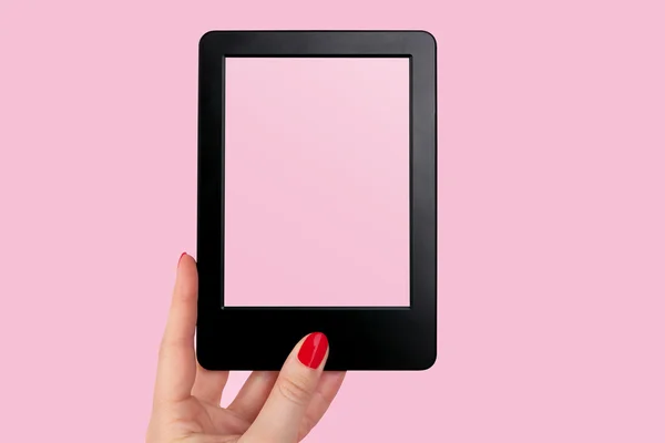 Female hand with red nails holding e reader — Stock Photo, Image