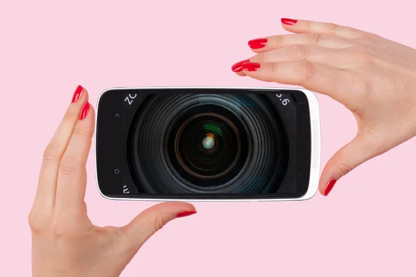 Female hands with red nails holding smartphone — ストック写真