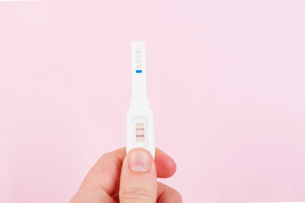 Father holding positive pregnancy test isolated. — Stock Photo, Image