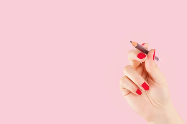 Female hand with pencil isolated. — Stock Photo, Image