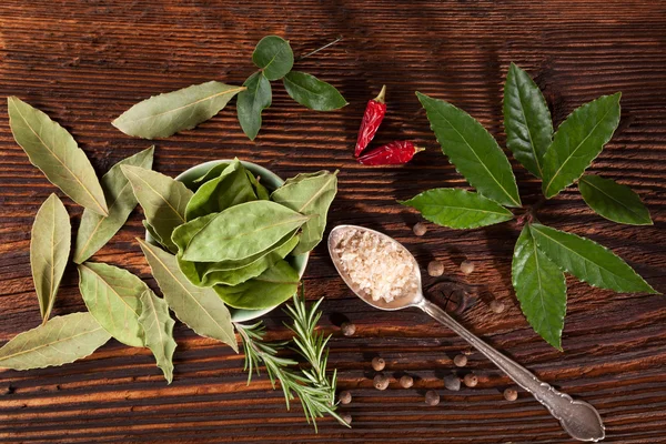 Spice and condiments wooden background. — Stock Photo, Image