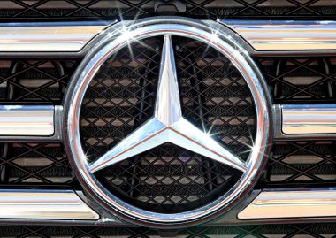 close up logo of Mercedes Benz on bumper  clipart