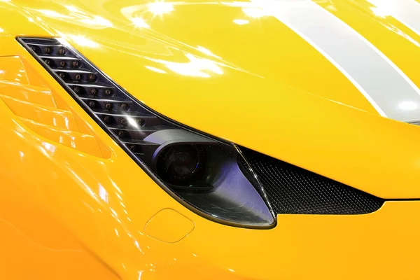 Headlight of ferrari  luxury sport car — стокове фото