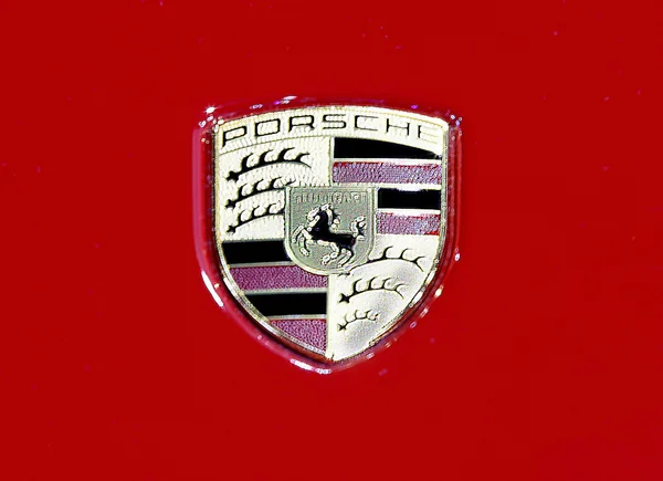 Logo of Porsche on red texture — Stockfoto