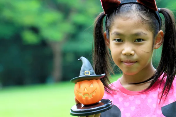 Close up portrait of Asian girl hold pumpkin doll — Stock Photo, Image