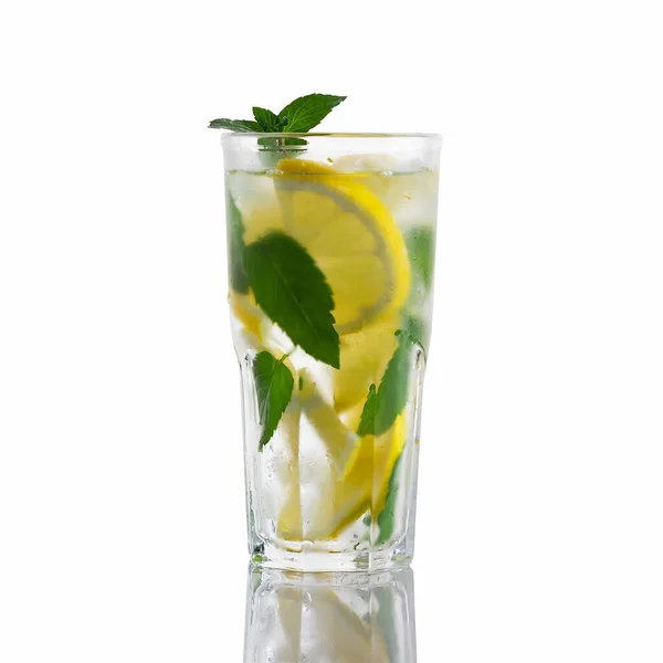 Fresh homemade cocktail in a tall glass with lemon, mint and ice isolated on white background — Stock Photo, Image