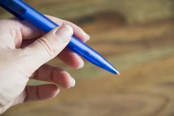 Hand met pen — Stockfoto