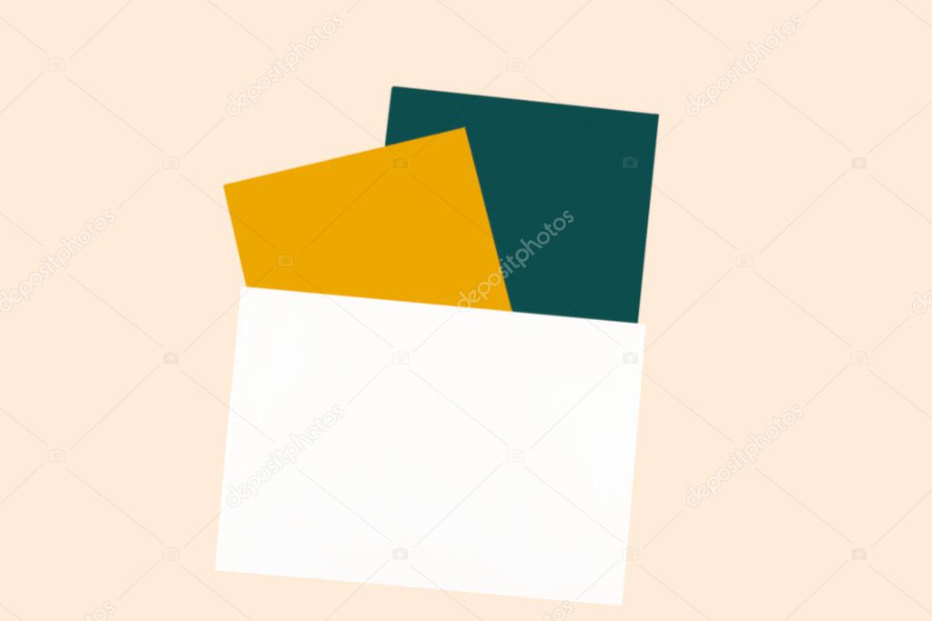 Invitation card mock up. Festive greetings cards and envelope in colors of year 2021 Set Sail Champagne, Fortuna Gold, Tidewater green. Copy space for text