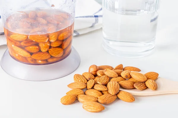 Step by step recipe. Cooking nuts vegetable milk. Step 2pour water to almonds in blender. Homemade food concept. Plant based organic veggie milk, lactose free.