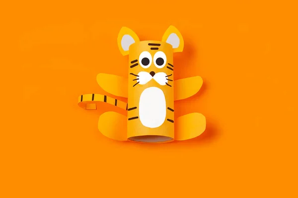 DIY and kid\'s creativity. Step by step instruction: how to make symbol of 2022 of tiger from toilet roll tube. Step3 finished craft. Children New year and christmas Craft
