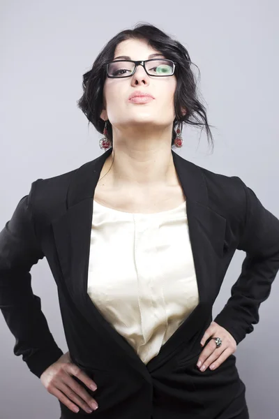 Sexy brunette. Business woman in a simple jacket. Woman wearing glasses — Stock Photo, Image