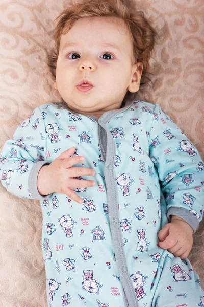 Beautiful baby with a lovely toys.The child in the crib — Stock Photo, Image