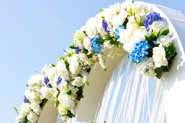 Wedding arch outdoors. Natural flowers. Decor. Floristics. visiting ceremony