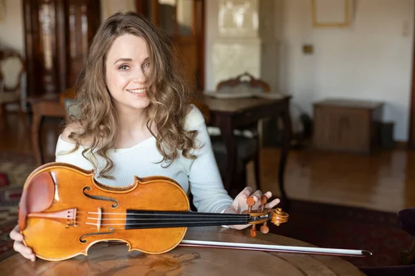 Smiling woman with violin . Music teacher online. Violin teacher