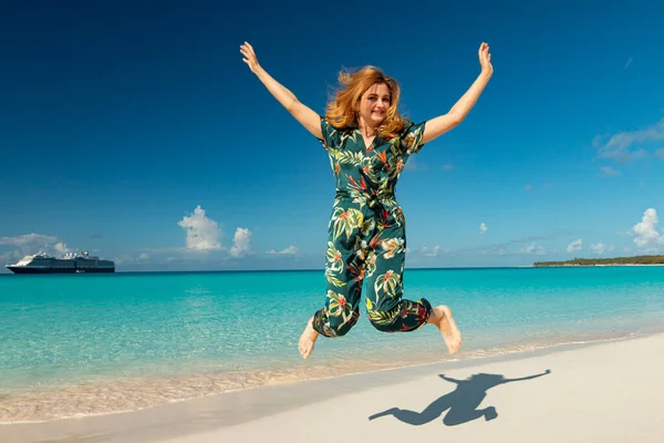 happy person jumping on the beach