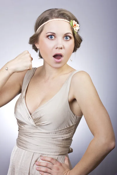 Cheerful young girl in surprise. Emotions on his face. Portrait of a beautiful young woman — Stock Photo, Image